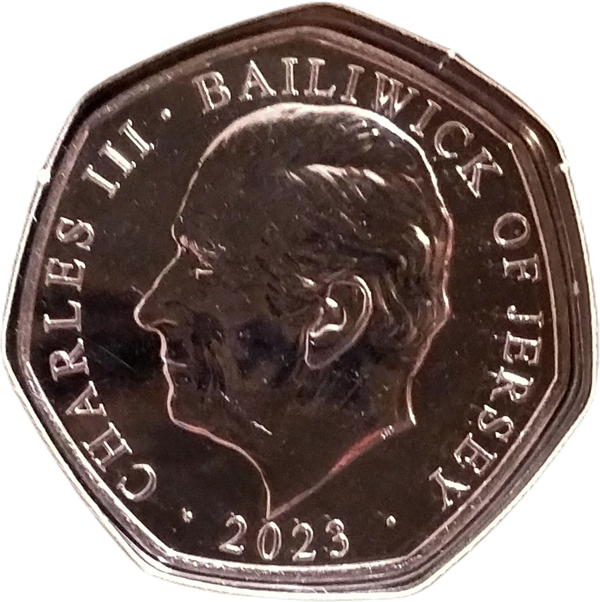 Jersey 50 Pence - Charles III Father Christmas with toys obverse