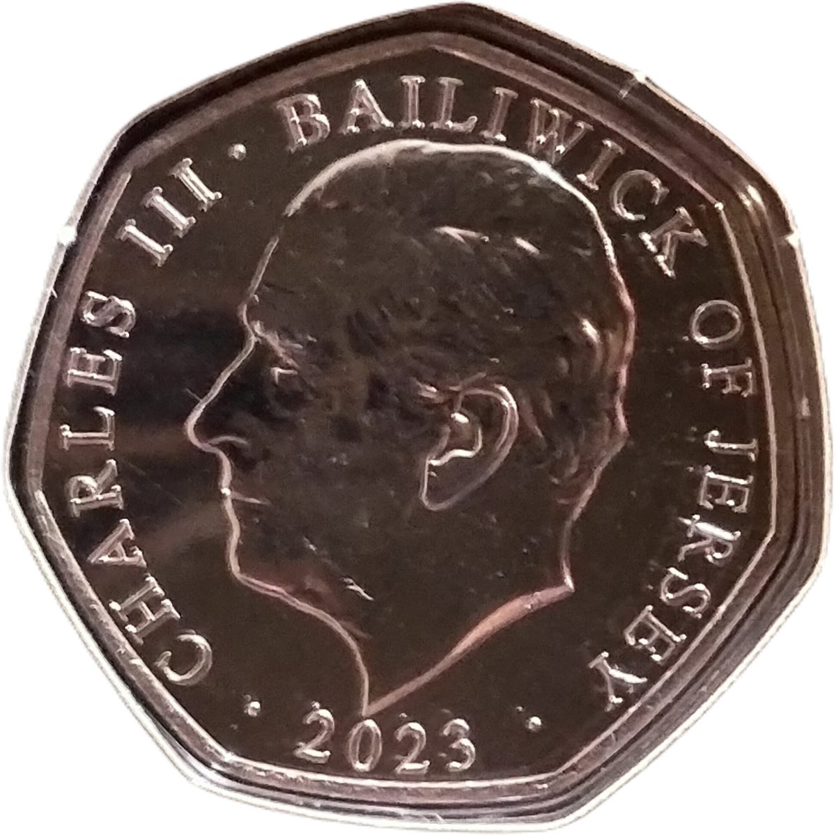 Jersey 50 Pence - Charles III Father Christmas and Christmas tree obverse