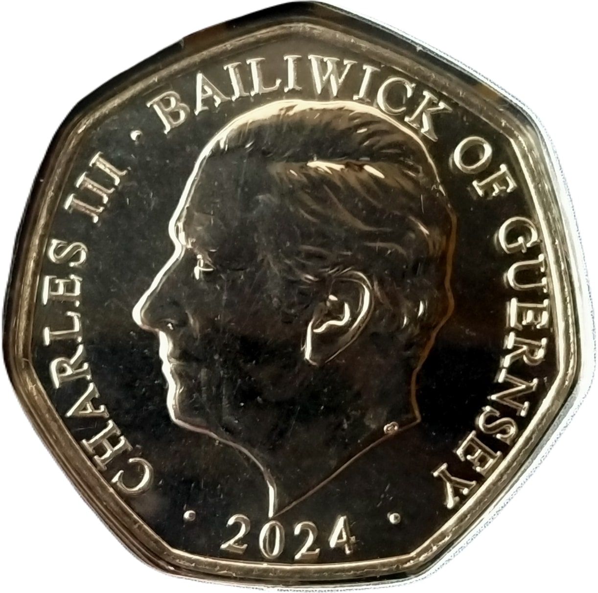 Guernsey 50 Pence - Charles III Christmas Snowmen - Father Christmas obverse