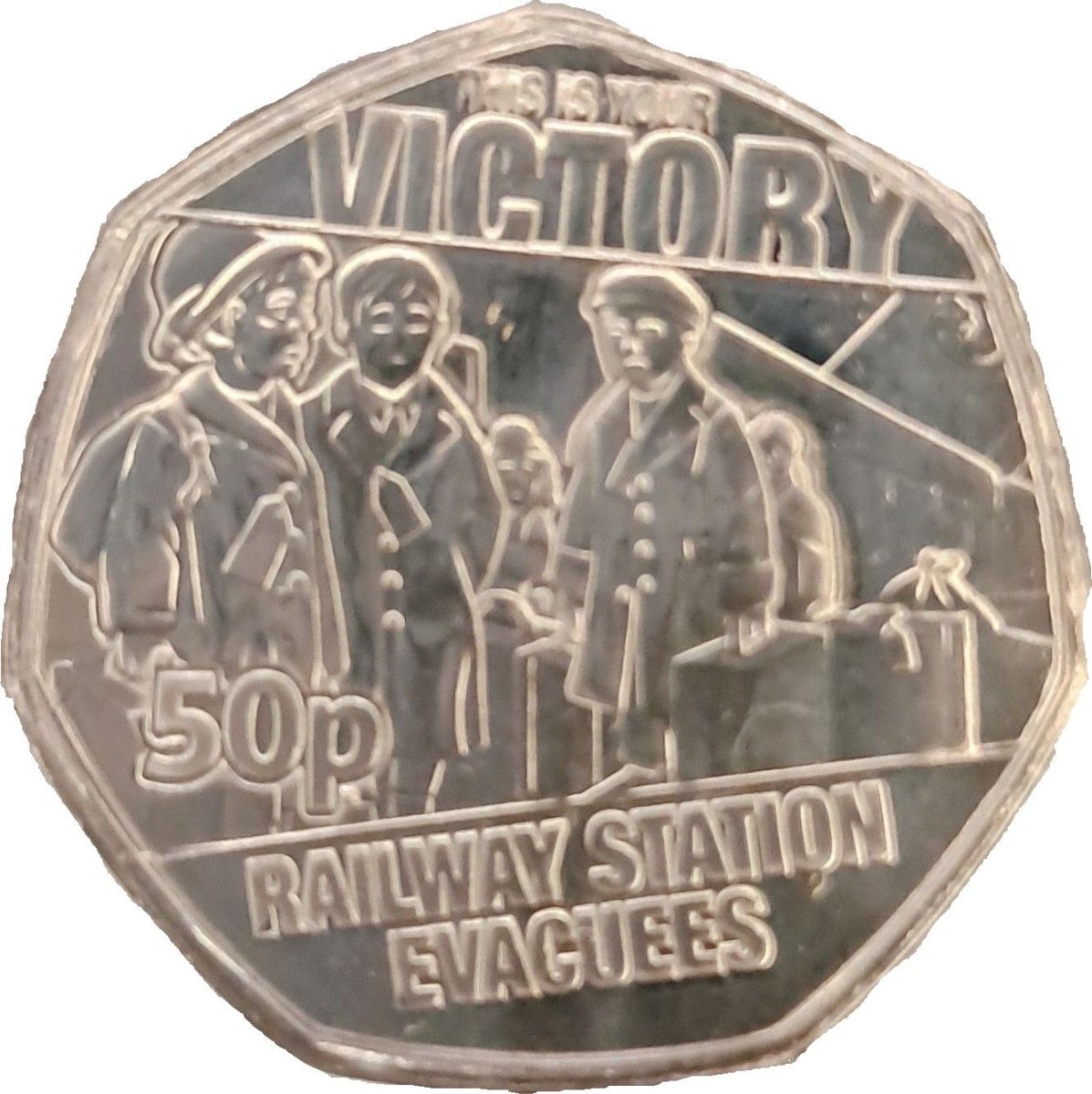 Guernsey 50 Pence - Charles III Railway Station Evacuees reverse