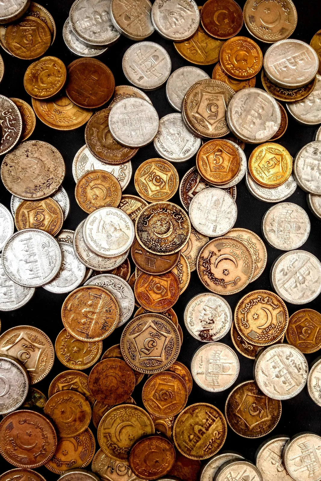 Collection of coins Collection of assorted coins laid out together