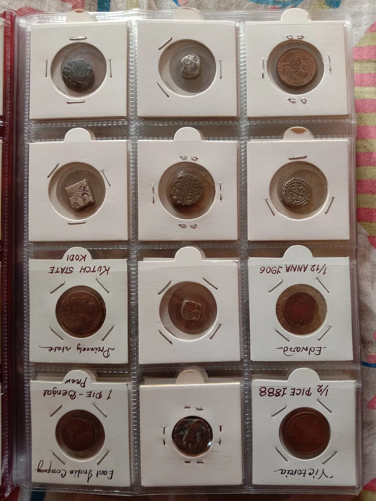 Coins arranged in a collection album Numismatic collection of coins arranged in a collector's album
