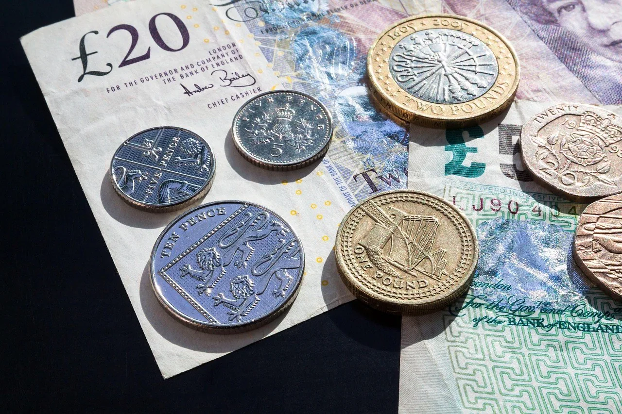 Pound coins and banknotes Pound coins and banknotes together