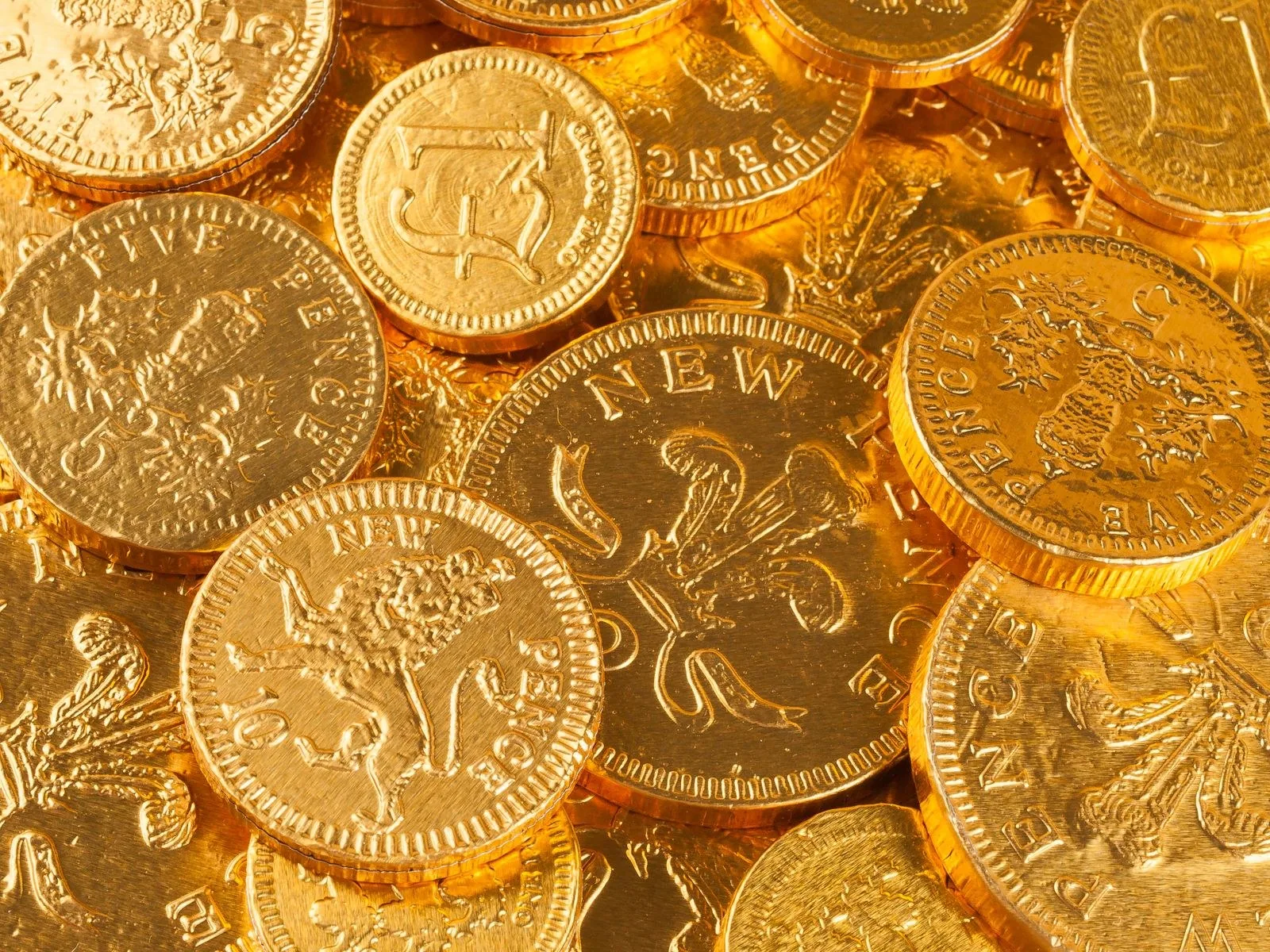 Pile of gold-coloured coins Pile of gold-coloured coins