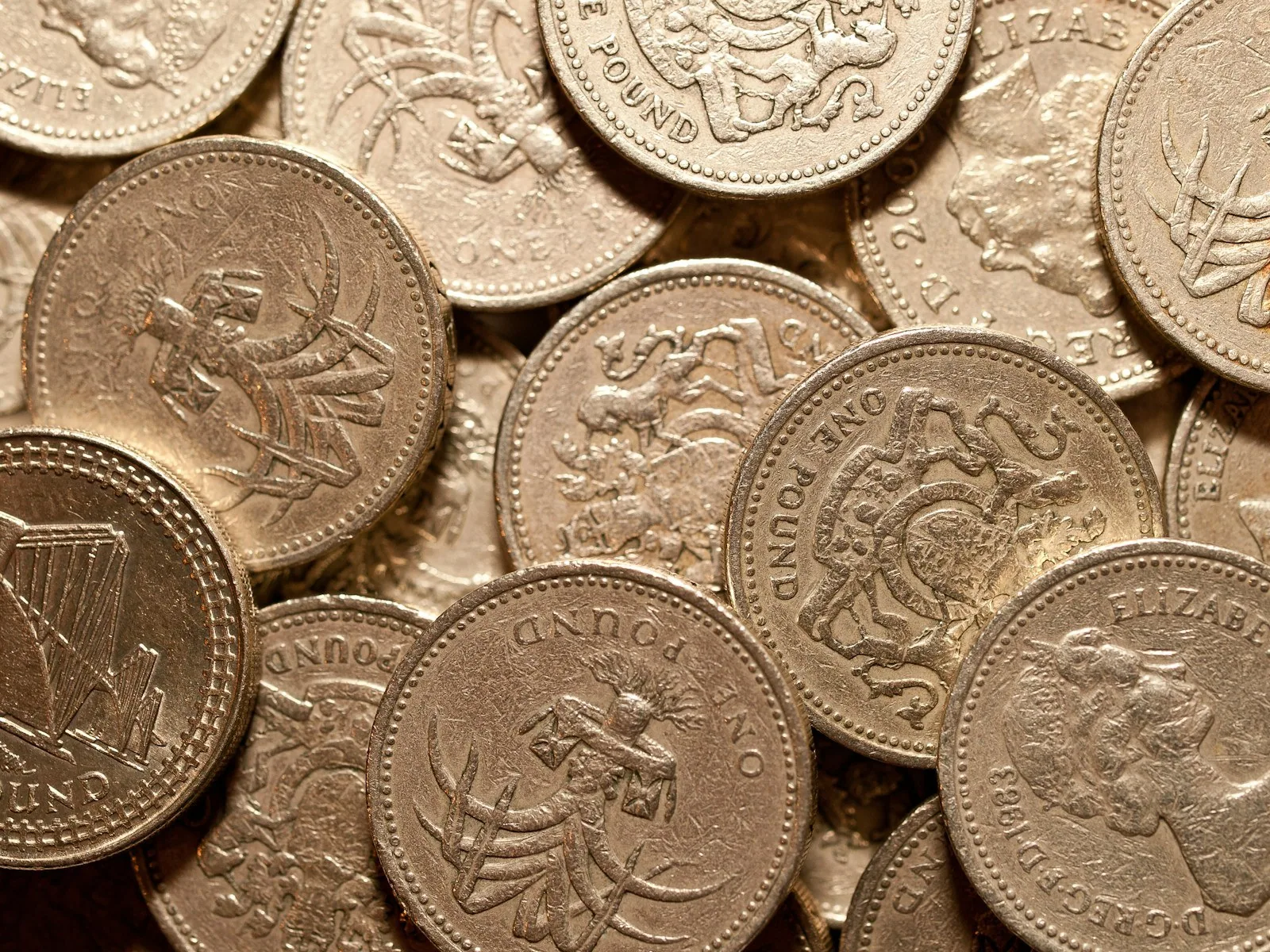 Pile of UK pound coins Pile of UK pound coins