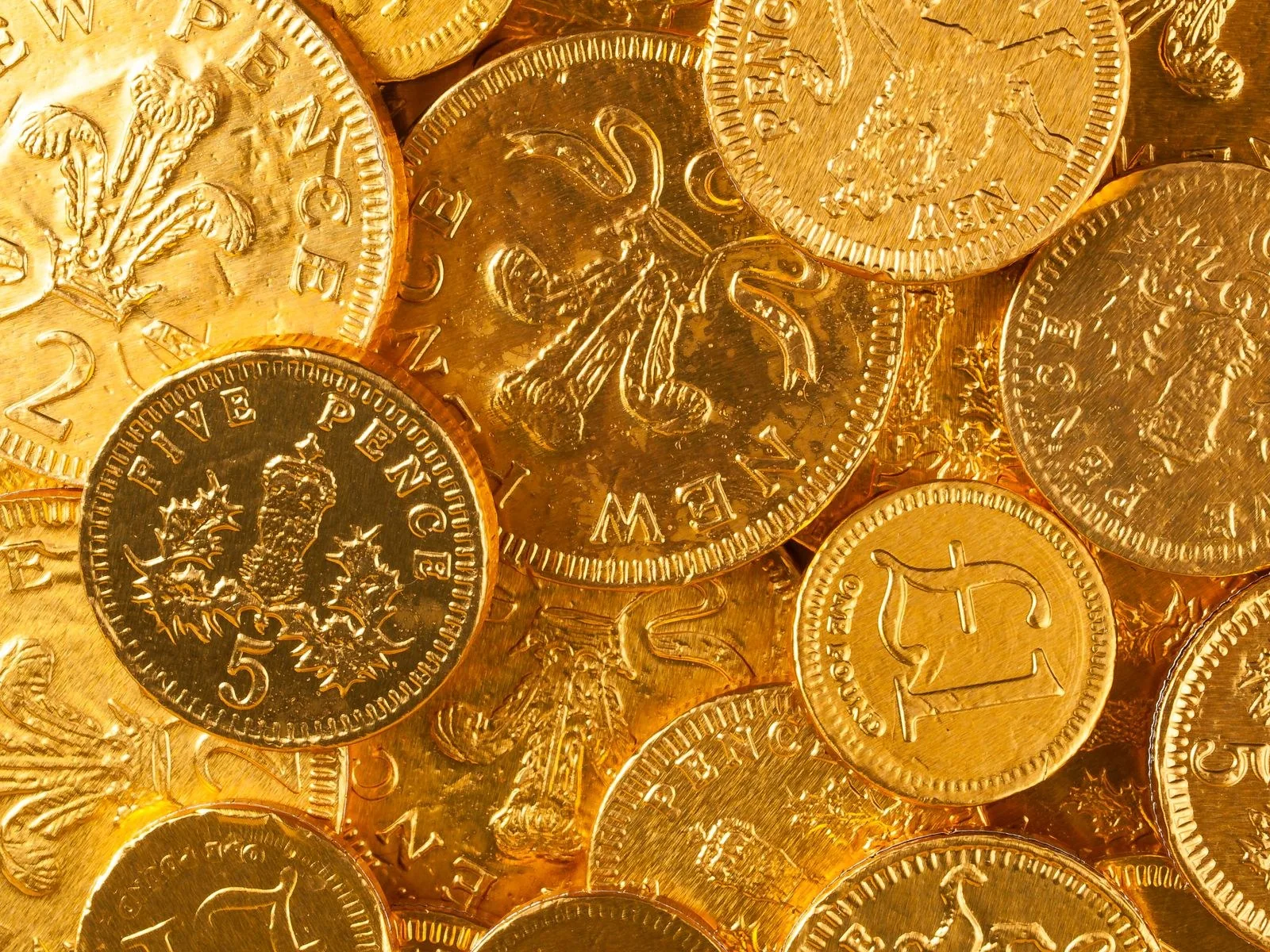 Close-up of bronze and gold-coloured pennies