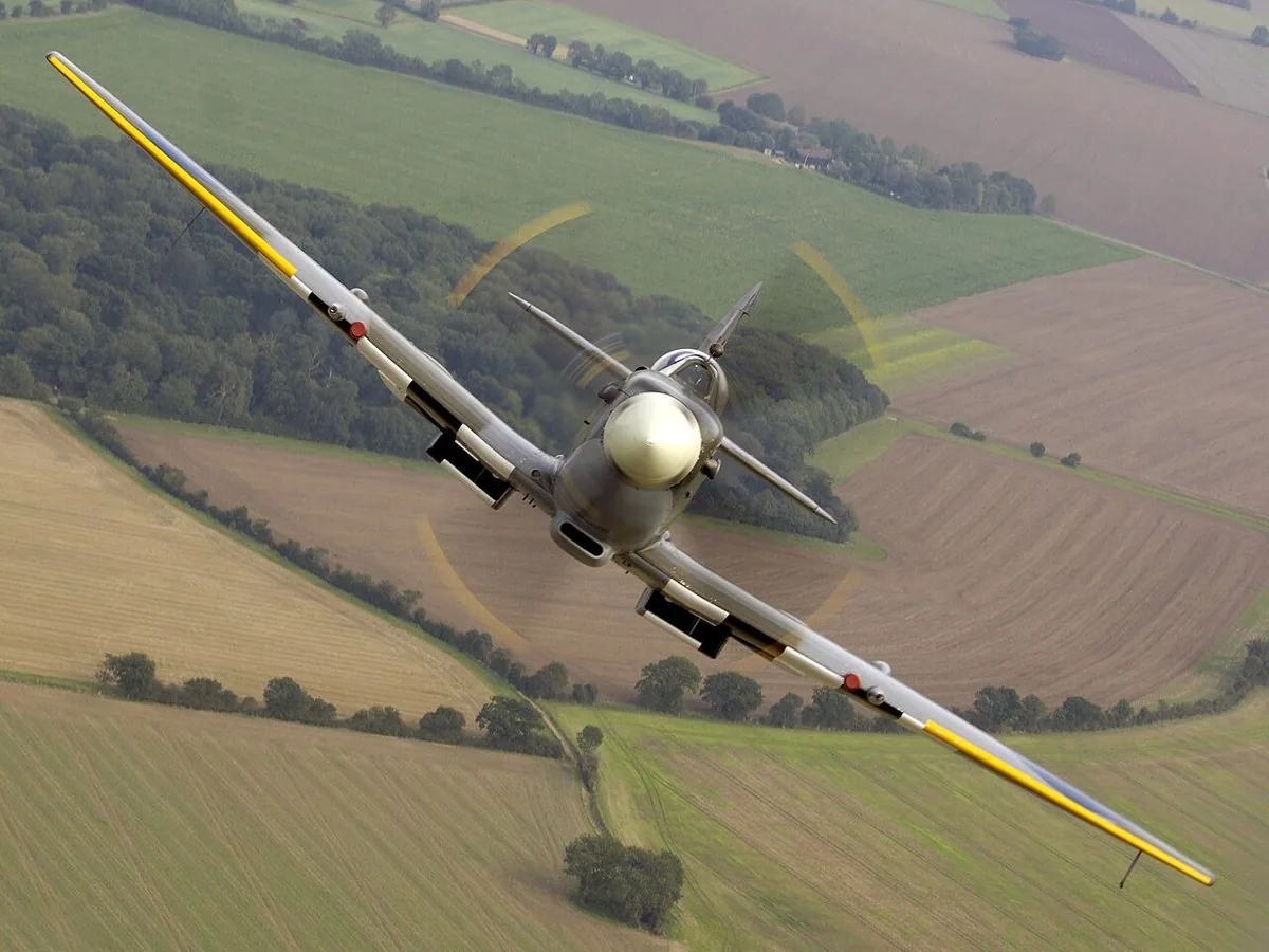 Supermarine Spitfire in flight over RAF Coningsby Supermarine Spitfire in flight over RAF Coningsby