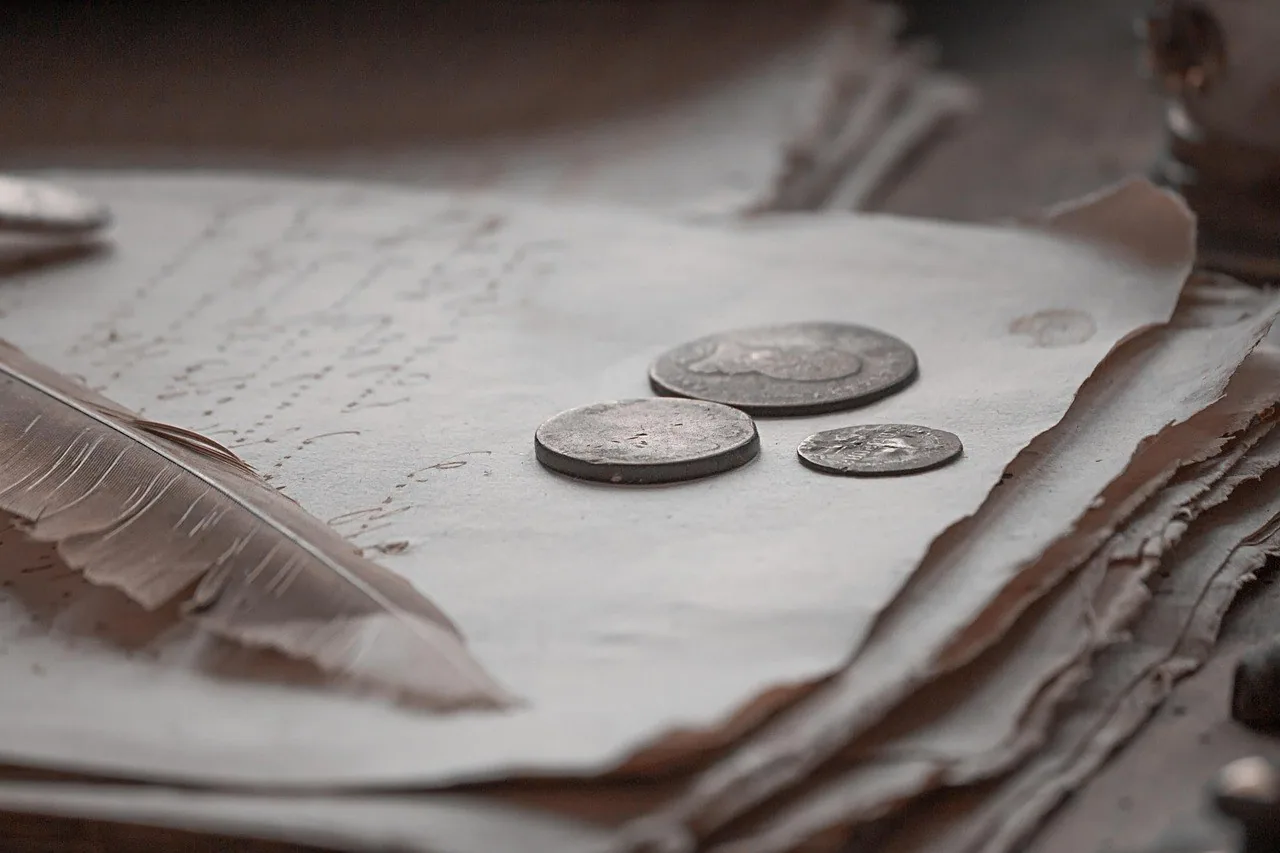 Coin on an old book Coin resting on an old book