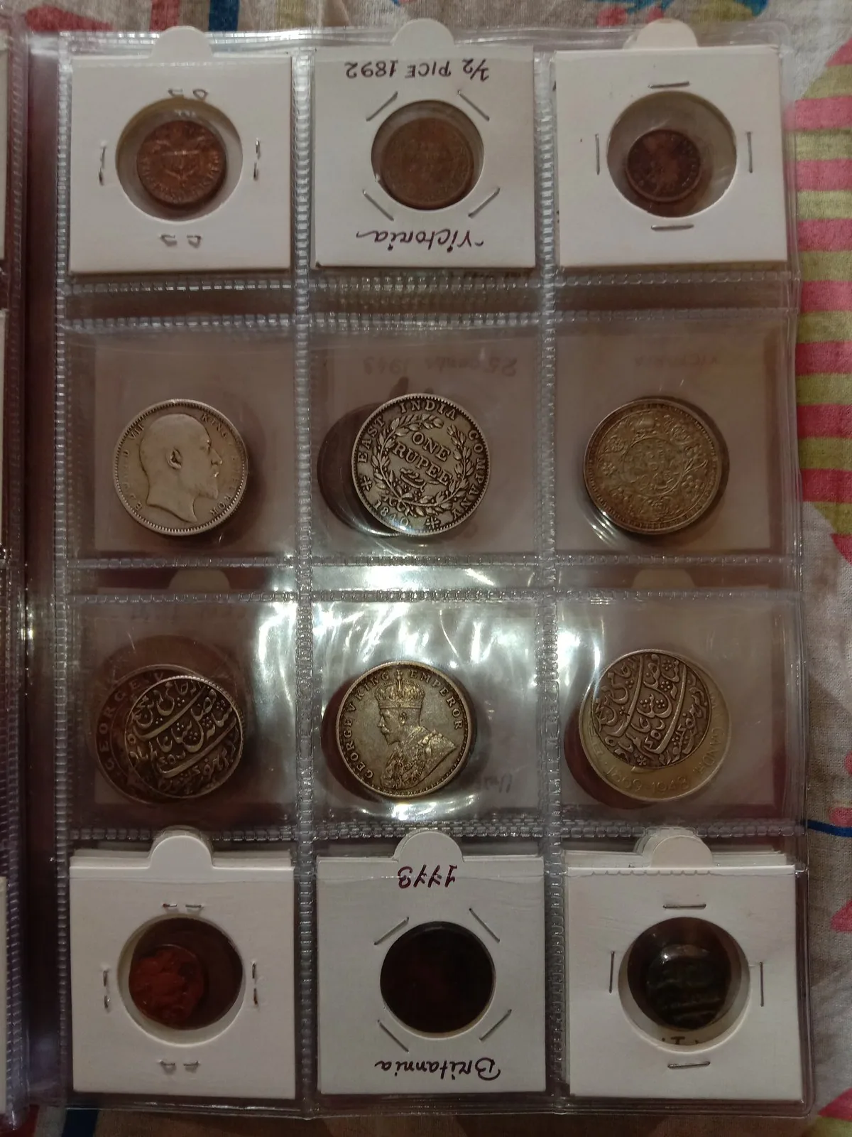 Coin album page with silver coins Coin album page holding silver coins in labelled pockets